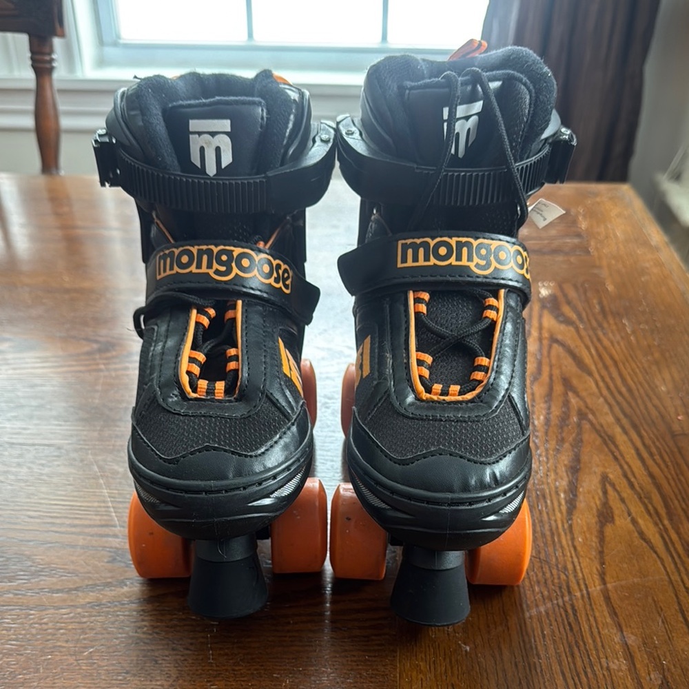 Mongoose Black and Orange Roller Skates
